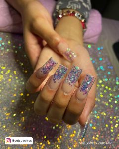 Square Glitter Acrylic Nails Over Shimmery Surface