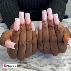 Square Light Pink Nails On A White Marble Surface