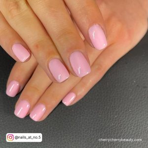 Square Pink Nails Short On A Black Surface