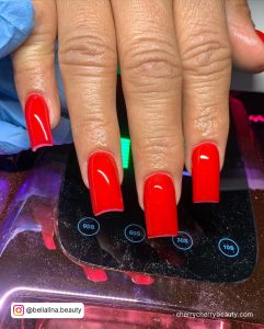 Square Sexy Red Acrylic Nails On Uv Nail Dryer