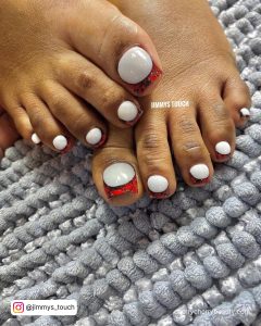 Toe Nail Acrylic Tips In Red And Black