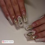 White And Gold Acrylic Nails With Flowers And Rhinestones