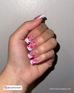 White Nails With Pink Heart Design And French Tips