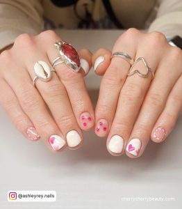 White Nails With Pink Heart Design On Short Nails