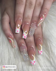 White Nails With Pink Heart Design With Swirls And Glitter