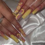 Yellow Acrylic Nails With Glitter And Flowers