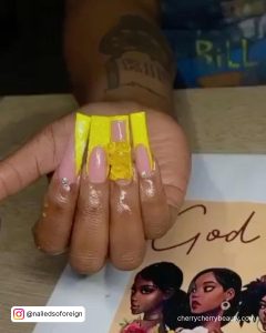 Yellow Acrylic Nails With Teddy Bear On One Finger