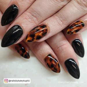Almond Nail Designs Black With Textured Design On Two Fingers