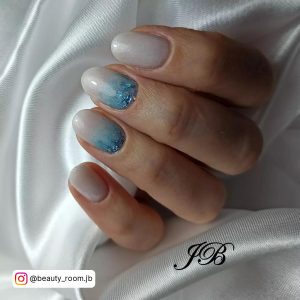 Baby Blue Ombre Nails With Glitter