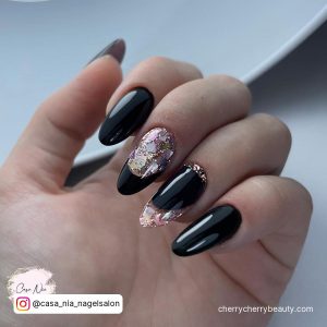 Black Almond Nails Design With Embellishments
