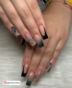 Black And Clear Marble Nails With Butterfly Design