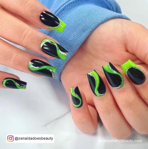 Black And Green Christmas Nails With Glitter Swirls