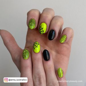 Black And Green Gel Nails With Spirals And Webs