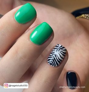 Black And Green Nails Short With Zebra Print On Ring Finger