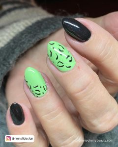 Black And Lime Green Nails In Almond Shape