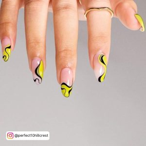 Black And Neon Yellow Nails In Almond Shape