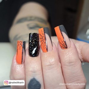 Black And Orange Acrylic Nails With Spider Web