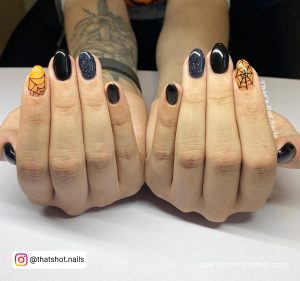 Black And Orange Almond Nails With Glitter