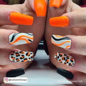 Black And Orange Marble Nails With Cheetah Print