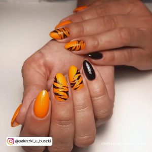 Black And Orange Nails Halloween In Almond Shape