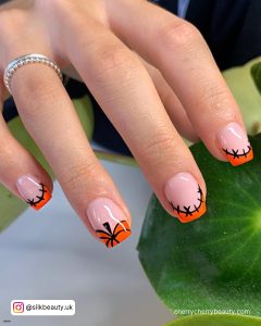 Black And Orange Nails With Stitches