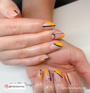 Black And Orange Tip Nails With Lines