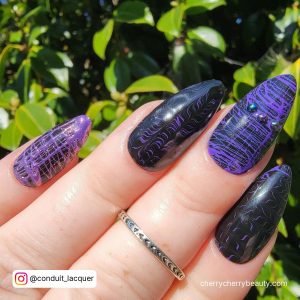 Black And Purple Acrylic Nails In Stiletto Shape