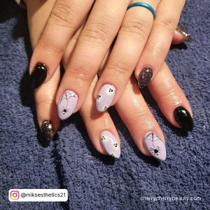 Black And Purple Gel Nails With Ghosts