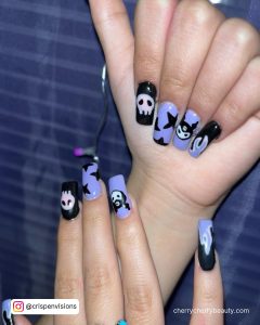 Black And Purple Halloween Nail Designs With Skulls And Stars