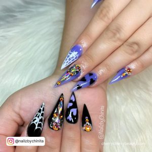Black And Purple Halloween Nails With Webs And Hearts
