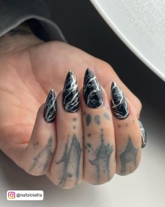 Black And Silver Marble Nails In Stiletto Shape
