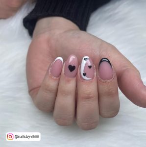 Black And White Heart Nails With Pink Base Coat