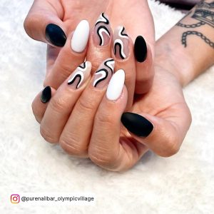 Black And White Swirl Nail Design In Almond Shape