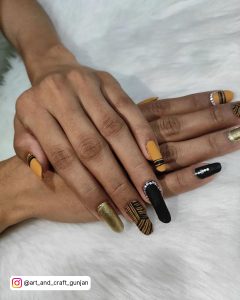 Black And Yellow Nail Polish With Gold Combination