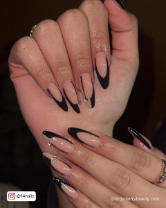 Black French Tip Almond Nails With Nude Base Coat