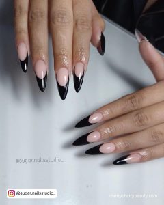 Black French Tip Nails Stiletto With Nude Base Coat