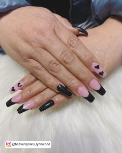 Black French Tip Nails With Hearts On Index Finger