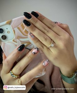 Black Glitter Nail Ideas With Design On Two Fingers
