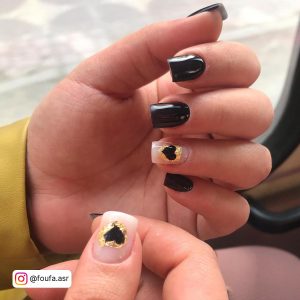 Black Nail Designs With Hearts And Golden Outer Side