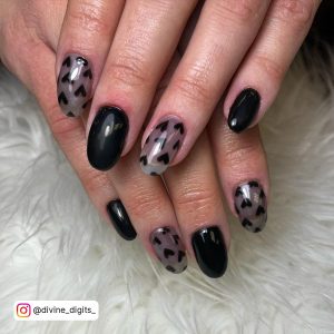 Black Nails With A Heart On Almond Shape