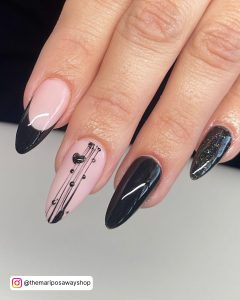 Black Nails With Heart Design On Middle Finger