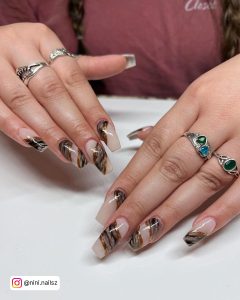 Black Nails With Marble Design And Nude Base Coat