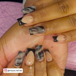 Black Nails With Marble Effect And Diamonds