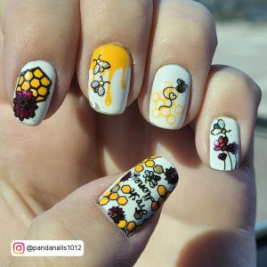 Black Red And Yellow Nails With Flies And Flowers