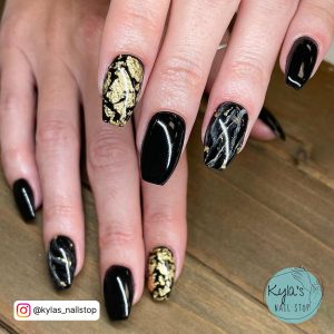 Black White And Gold Marble Nails For A Fancy Look