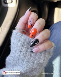 Black White And Orange Nails With Moon And Stars