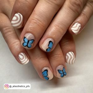 Blue French Tip Nails With Butterflies