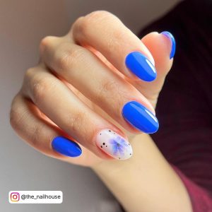 Blue Nail Art With Design On Ring Finger