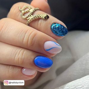 Blue Nails Designs With Swirl And Glitter