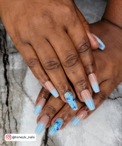 Blue Ombre Coffin Nails With Design On Ring Finger